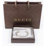 A silver Gucci torque bangle in the form of bamboo, width approx 10mm, internal diameter approx
