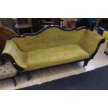 A Victorian mahogany boat-shaped chaise in mustard velvet over an unpadded chaise