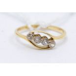 An Edwardian diamond and 18ct gold ring, cross over shoulders inset with a line of collet set old