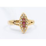 An early 20th Century ruby and pearl set 18ct gold dress ring, marquise shaped setting, set to the