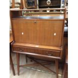 A 1950s slim bureau along with a chest of drawers - two above one - both on tapered legs