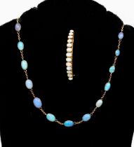 An early 20th Century opal necklace and yellow metal line necklace, comprising oval graduated