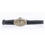 An Art Deco platinum and diamond set ladies dress watch, oval silvered dial with Arabic numerals,