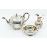 A matched Victorian three piece tea service comprising teapot, sugar bowl and milk jug, each body