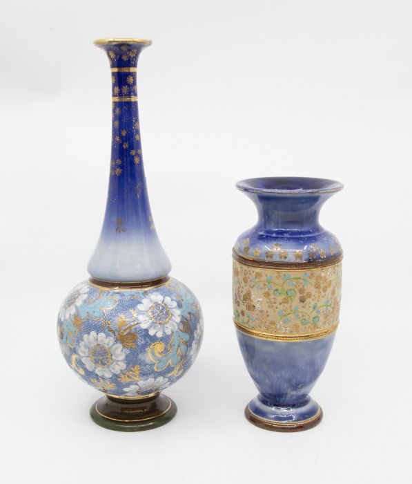 Two early 20th Century Royal Doulton Lambeth blue ground vases, hair line on tall vase on neck
