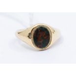 A 9ct gold and bloodstone signet ring, oval form, width approx 11mm, size M, total gross weight