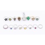 A collection of sixteen Gems TV gem set silver rings to include, a peridot and black spinel cluster,