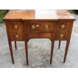 ***AUCTIONEER TO ANNOUNCE LOT WITHDRAWN*** A late Georgian mahogany small sideboard; with two deep