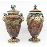 Majolica pair of vases with lids, rams head on sides
