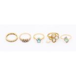 a collection of Gems TV 9ct gold dress rings to include a cubic zirconia half eternity ring, emerald