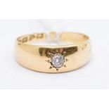 A diamond and 18ct gold ring, the centre star set with an old cut diamond approx 0.10ct, size P1/
