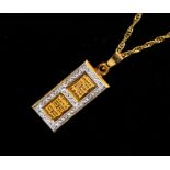 A 9ct yellow and white gold pendant, limited edition no: 1395 on 9ct yellow gold fancy chain with