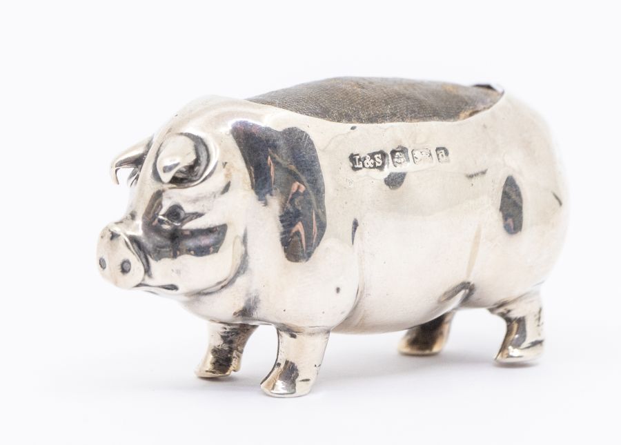 An Edwardian silver novelty pin cushion modelled as a pig, hallmarked by Levi & Salaman,