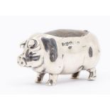 An Edwardian silver novelty pin cushion modelled as a pig, hallmarked by Levi & Salaman,