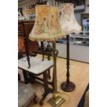 Two mid 20th Century standard lamps, one brass Corinthian column on lions feet, the other wooden