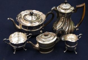 A George III style EPNS three piece tea service comprising teapot, milk jug and creamd jug, plain