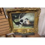 A 20th Century Oil on Board painting of kittens in an ornate gilt frame