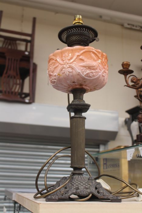 A Victorian cast metal oil lamp, converted to electric