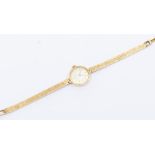 A ladies 9ct gold Ollivant and Bottsford wristwatch, round dial with baton markers, case diameter