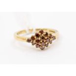 A cinnamon diamond and 9ct gold cluster ring, comprising a diamond shaped cluster of round brilliant