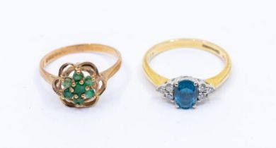 A blue topaz and diamond 18ct gold ring, comprising a central claw set oval cut topaz with three