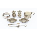 A group of mainly early 20th Century silver to include: pair of pepperettes; bangle, mustard pot and