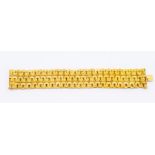 An 18ct gold bracelet, comprising wide woven three row links with textured decoration, approx. 27mm,