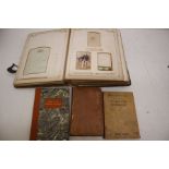Victorian photo album with pictures, along with a collection of 19th Century books including