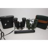 A collection of binoculars, specialised modern pairs, along with modern specialised telescopes and