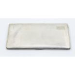 A George VI engine turned large silver rectangular cigarette case, engraved initials to cover,