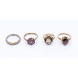 Two smoky quartz and 9ct gold dress rings, with oval cut stones, sizes K, Q, a 9ct ruby set cluster,