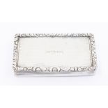 A William IV silver snuff box with floral edges and engine turned finish with the inscription ' Wm