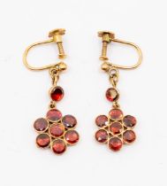 A pair of early 20th Century garnet and 9ct gold drop earrings, comprising a flower cluster of round