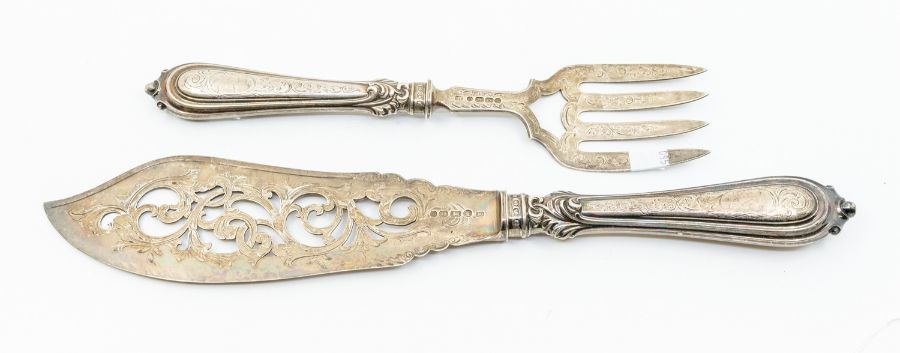 A pair of Victorian fish servers, the blade and tines engraved and pierced decoration, silver