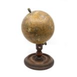 A late Victorian educational globe by EJ Arnold & Sons Ltd, Leeds, on mahogany stand