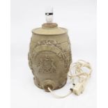A 19th Century stone ware sherry pot converted to a lamp, decorated with Royal coat of arms, lions