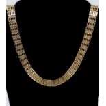 A 9ct gold collar necklace, comprising articulated textured links, width approx 10mm, length 18