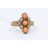 An opal and coral 9ct gold cluster ring, with a vertical row of cabochon cut coral with round cut