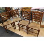 A set of four wicker seat chairs, with ladder backs