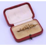 A gold seed pearl brooch