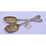 A pair of Georgian Irish silver berry spoons