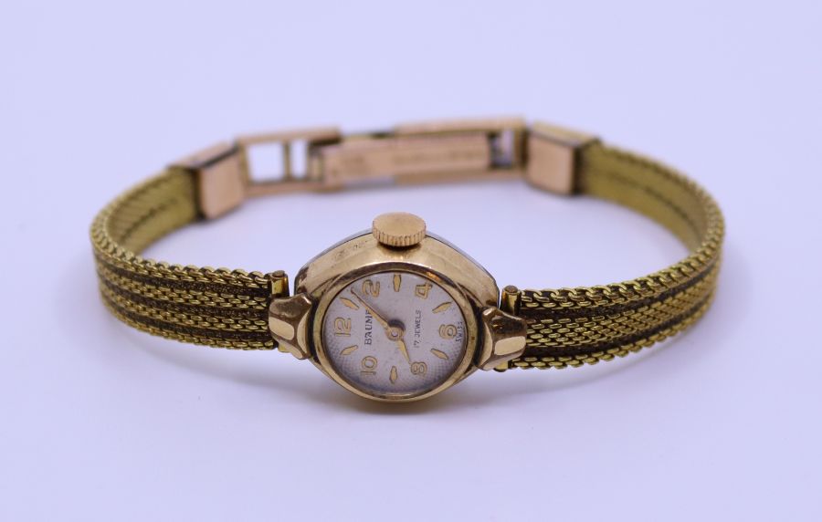 An yellow metal ladies watch