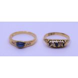 Two 18ct sapphire ad diamond rings, one set cabochon sapphire, the other with tree graduated