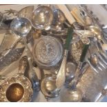 A collection of silver and plated items to include a silver strainer , indian silver and Jade