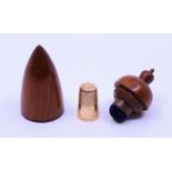 A treen acorn case and high Ct gold thimble