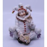 A 19th cent Vienna porcelain Harlequin figure