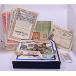 A collection of stamps, bonds, bank notes and coins to include so Chinese bond certificates
