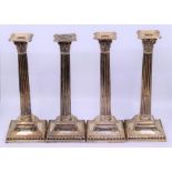 A fine set of four London 19th cent silver corinthian candlesticks Condition good no damages