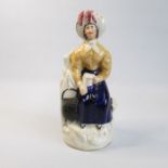 A Staffordshire figure – possibly a character from Dickens Circa: 1840 Size: 21cm H Condition: