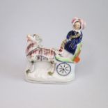 A small rare Staffordshire figure of Princess Royal being pulled by a goat in a carriage Circa: 1845